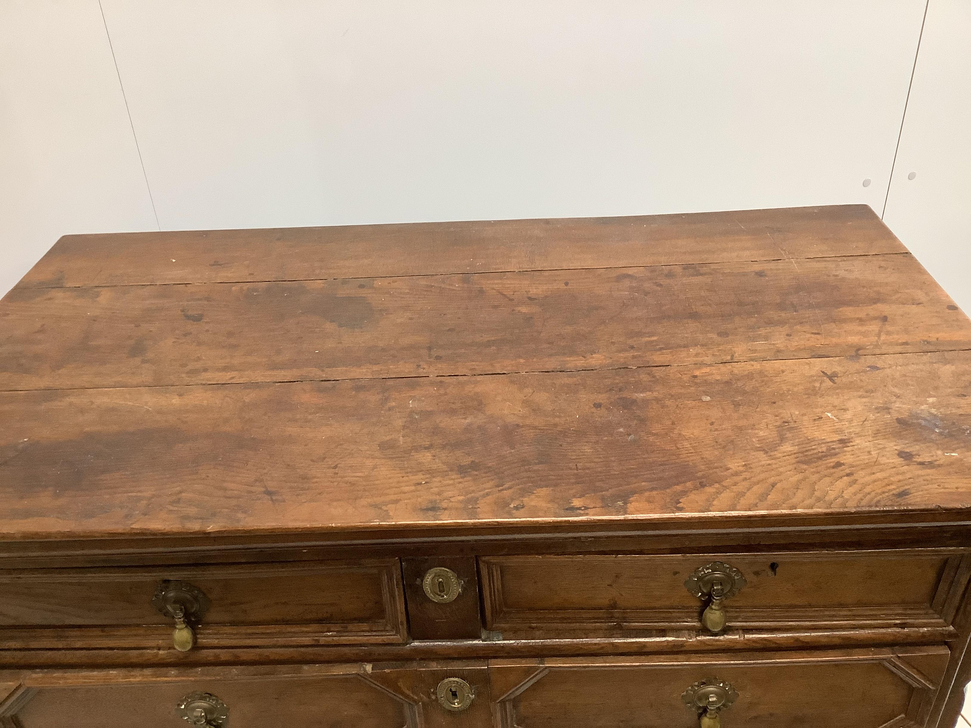 A 17th century and later oak chest of drawers, geometric moulding, raised on bun feet, width 102cm, depth 54cm, height 104cm